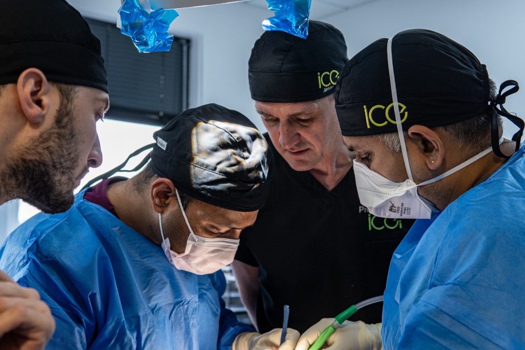 Supervised postgraduate dentists performing implant surgery at ICE Dental, offering affordable dental implants Manchester patients can access.